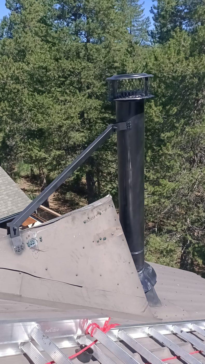 Black painted brace on a black chimney pipe